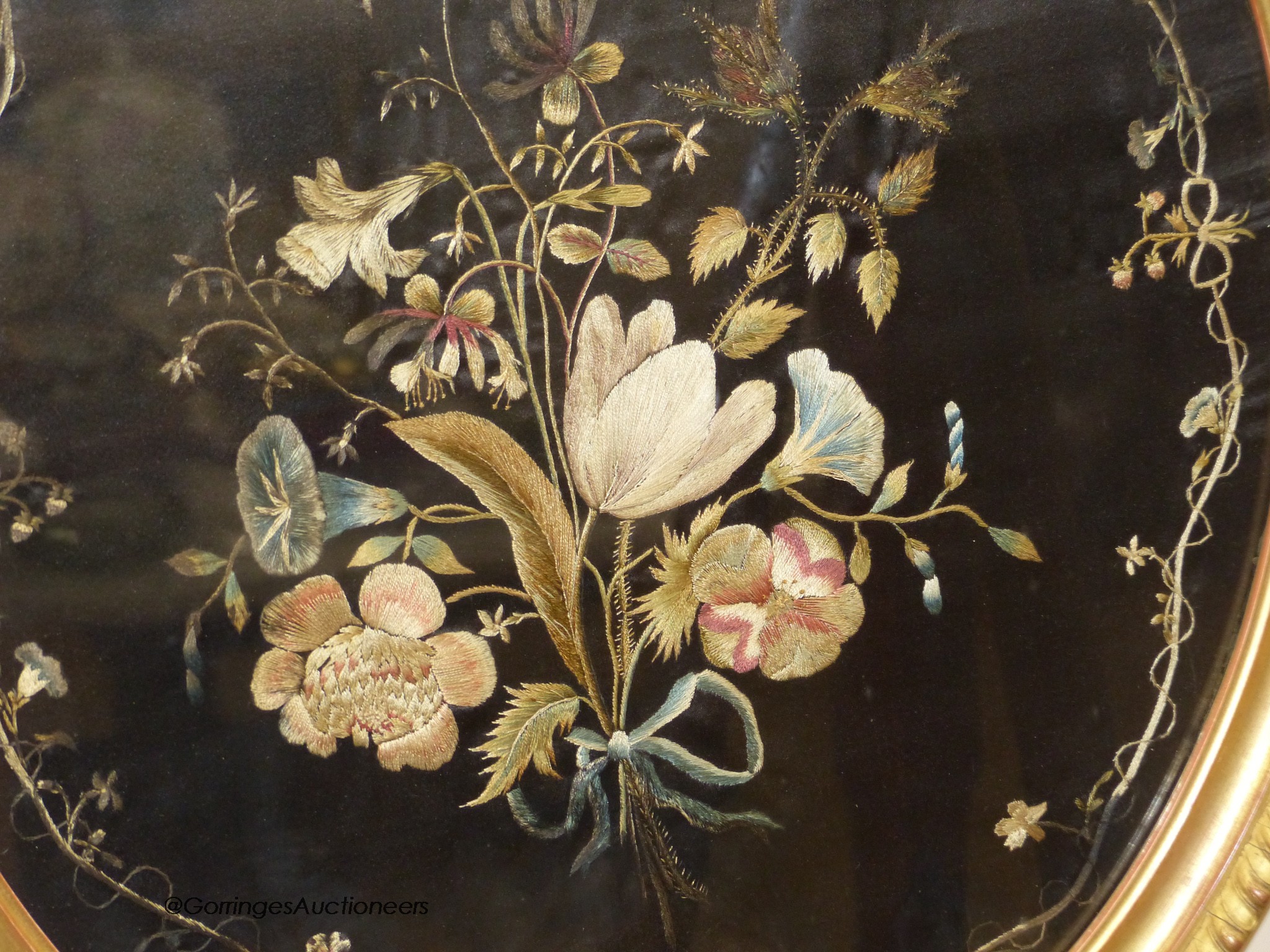 A 19th century silk embroidery of flowers on black silk background, 51 x 45cm